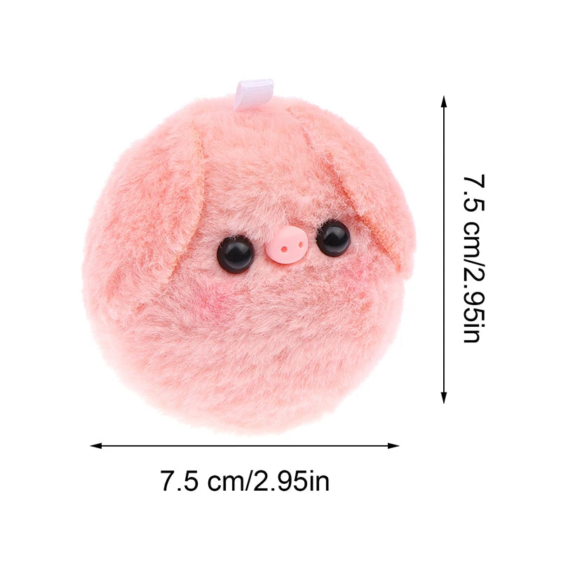 A pink fluffy plush pig with black eyes and a pink nose, used as a keychain or bag charm.