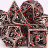A pile of blood dragon metal dice set for D&D and tabletop RPGs showing various polyhedral dice.