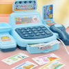 A blue interactive cash register toy with a cash register box and various paper money is displayed on a pink surface.