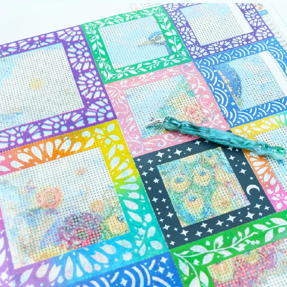 A colorful sheet of reusable non-stick release paper for diamond painting featuring various colored squares and decorative bo
