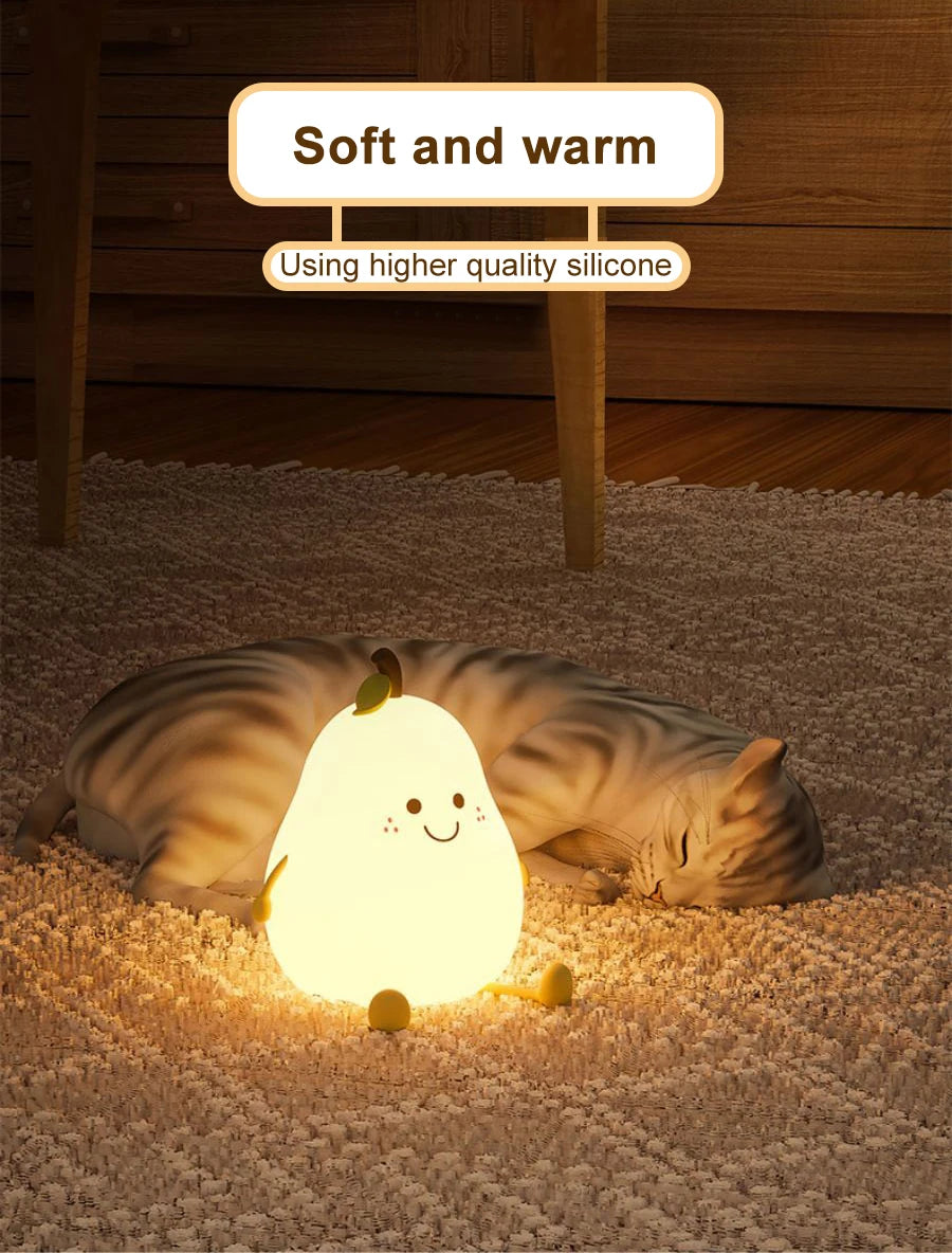 A soft, glowing pear-shaped night light resembling a cat is resting on a beige carpet.