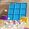 A blue Tic Tac Toe board game is shown with magnetic pieces scattered on a white surface.