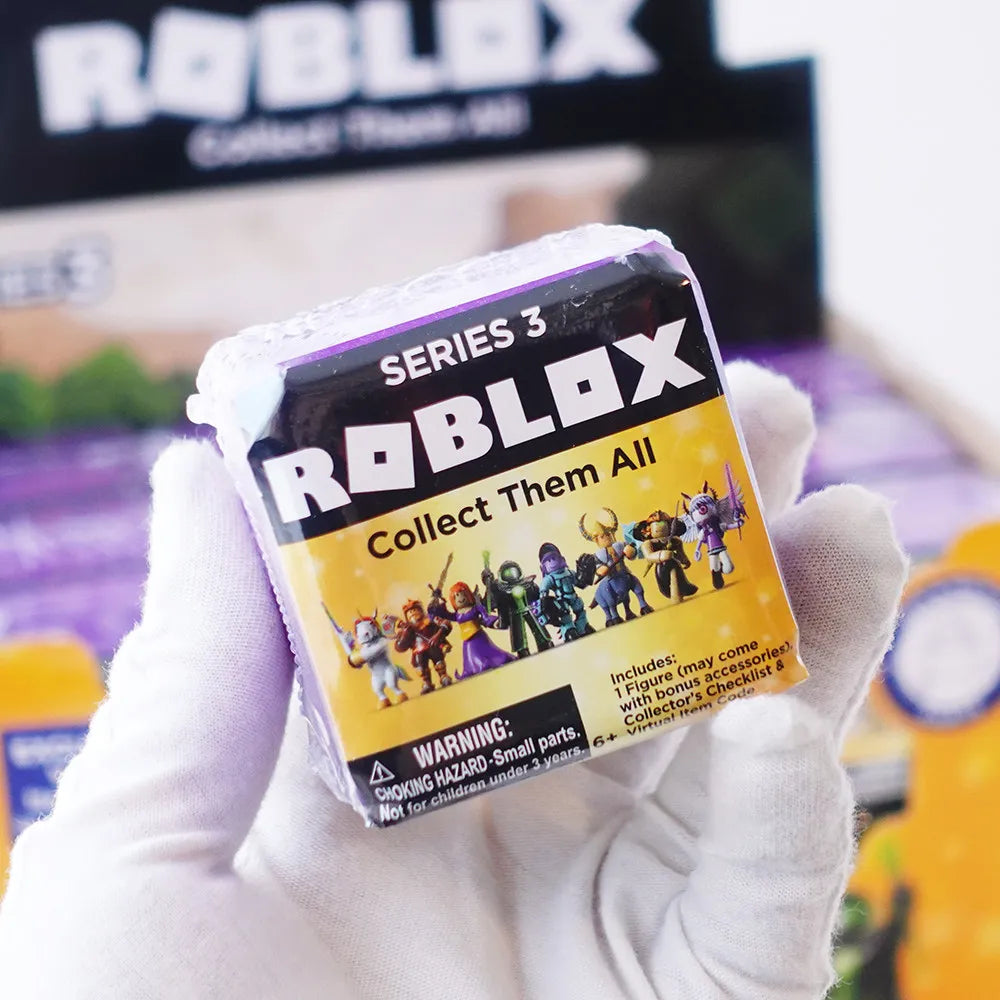 A hand holds a Roblox Series 3 Collect Them All figure packaged in its box.