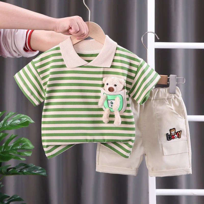 A green and white striped kids' summer outfit set featuring a short-sleeved shirt and matching shorts.