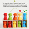 A set of five wooden dolls in various colors are arranged in compartments for color matching games.
