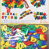 A large set of colorful, interlocking plastic building blocks in various shapes and colors for children's construction play