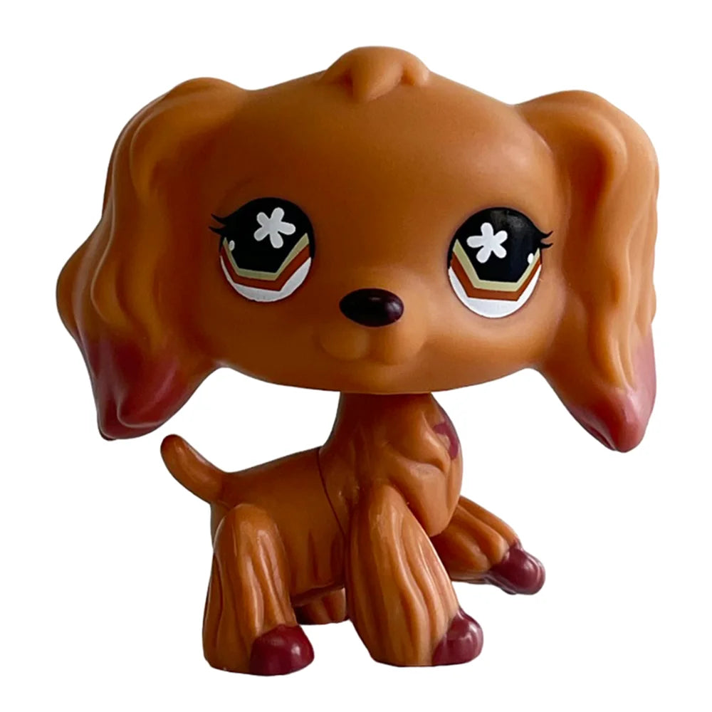 A small, tan Bobbing Deer bobblehead toy with large black eyes and a brown body.