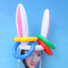 A set of Easter egg and spoon race game pieces featuring white, pink, yellow, green, and orange plastic items.