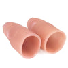 A realistic silicone fake thumb tip used for magic tricks, pink in color.