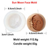 A round silicone mold shaped like a face used for making candles or soap.