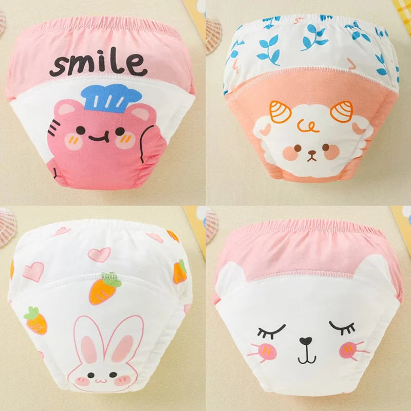 Four reusable cotton potty training pants for toddlers featuring cute animal faces and text