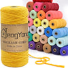 Spool of yellow cotton macrame cord used for DIY crafts and boho decor