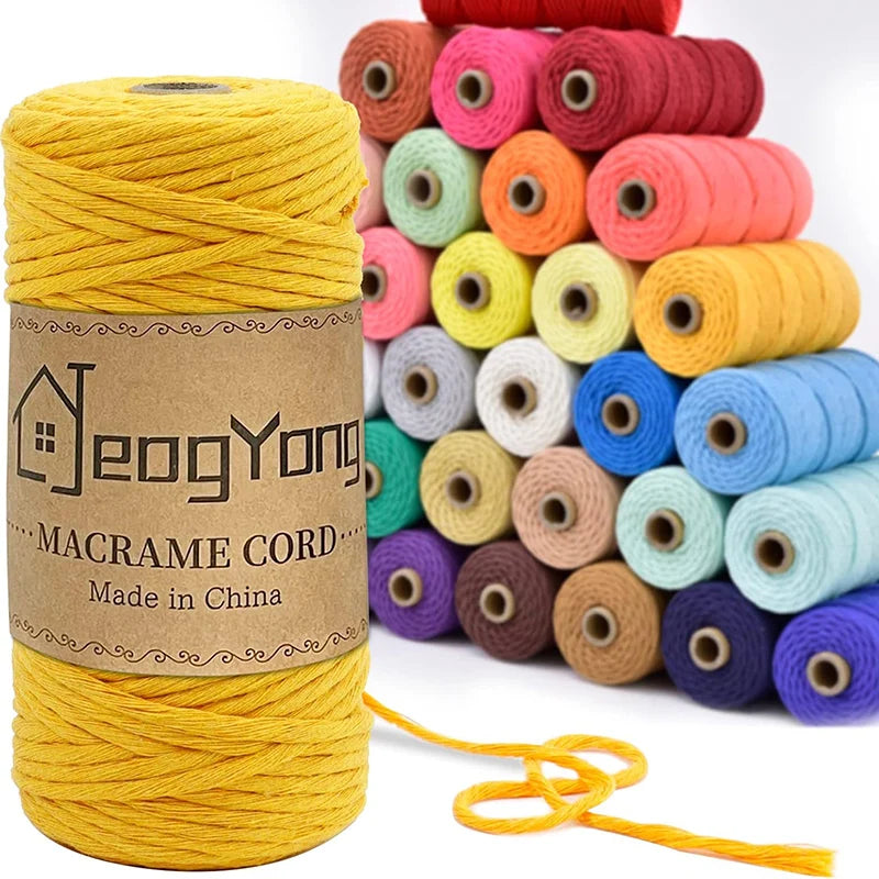 Spool of yellow cotton macrame cord used for DIY crafts and boho decor