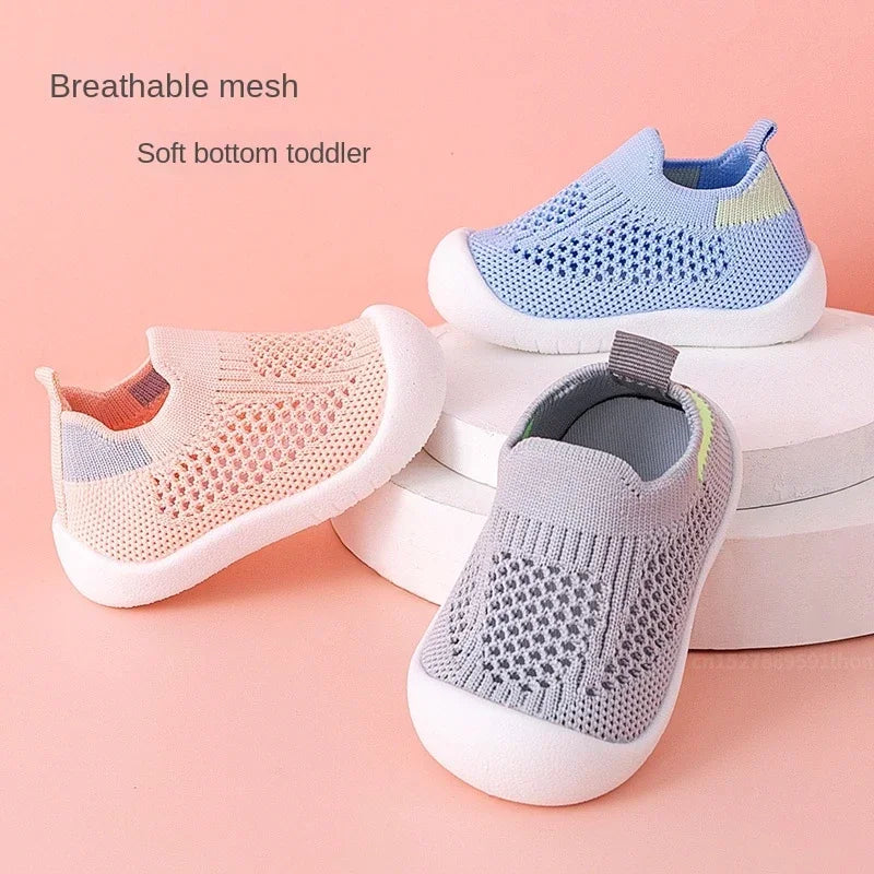 A pair of light blue and white breathable mesh slip-on sneakers for a toddler, shown next to a similar shoe.