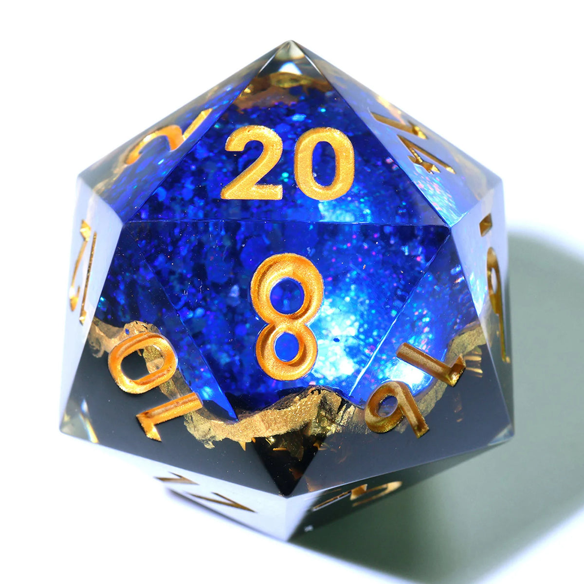 A handmade resin D20 die with a large blue and purple liquid swirl, showing the number 20.