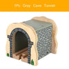A wooden cave tunnel model featuring an arched entrance and a textured gray wall.