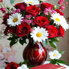A vibrant floral paint by number kit featuring roses, sunflowers, and peonies arranged in a bouquet.