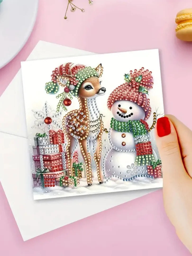 A watercolor illustration of a deer and a snowman decorated with festive Christmas elements on a greeting card.