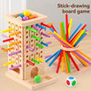 A wooden stick-drawing board game featuring a tower structure and colored sticks.