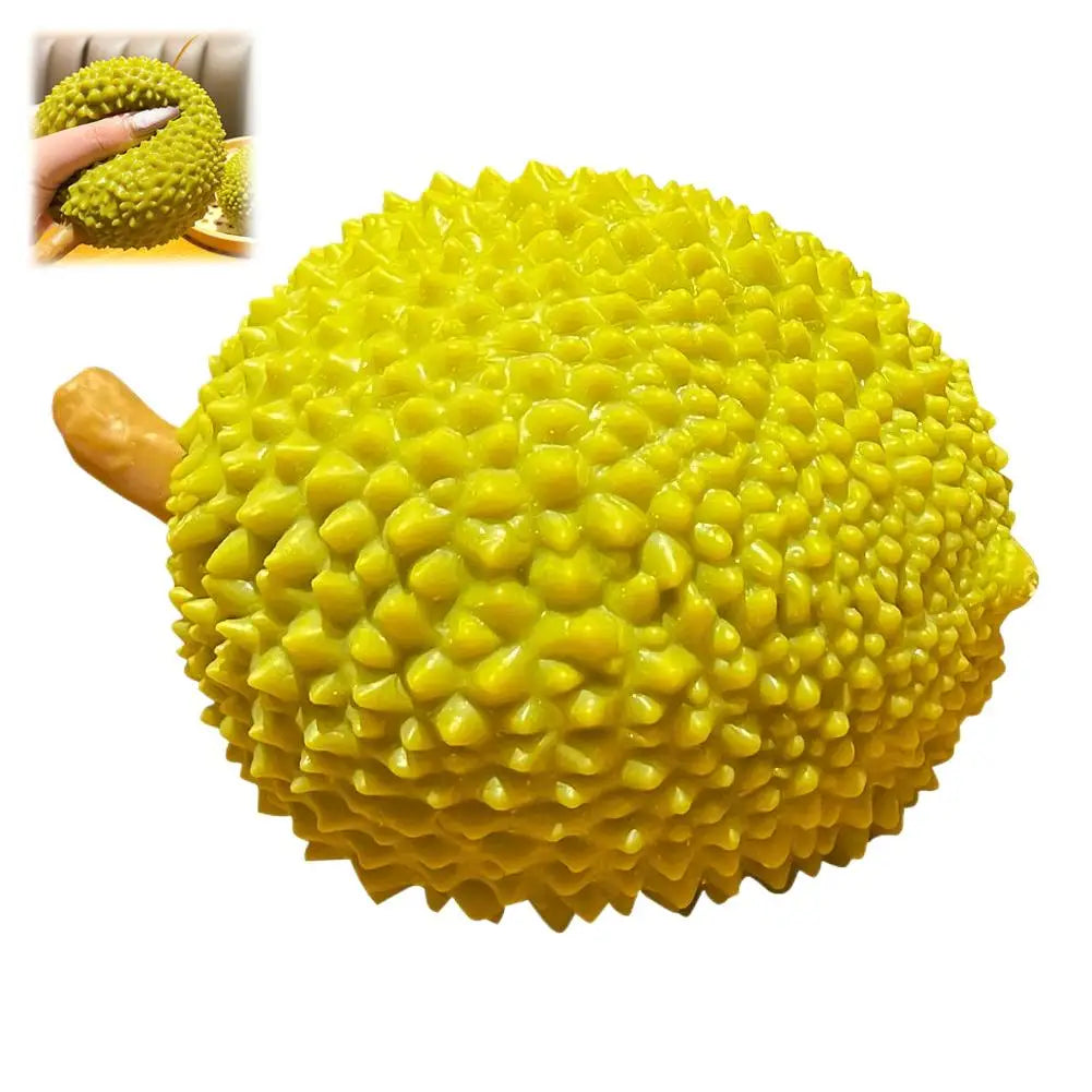 A bright yellow dragon fruit squishy stress relief toy with a bumpy texture.