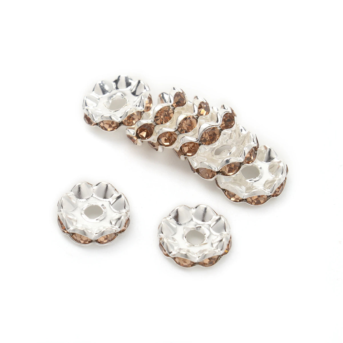 A collection of 12mm crystal rhinestone spacer beads in a gold-toned finish.