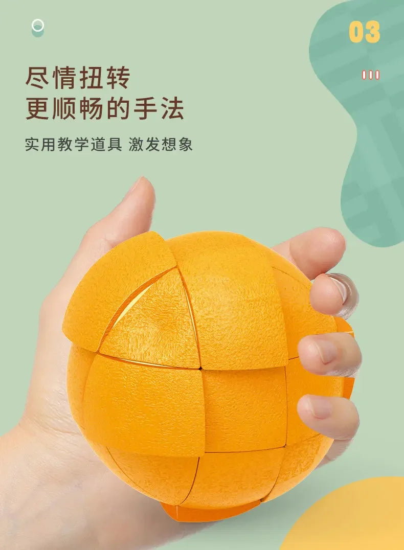 A hand holds an orange fruit-shaped 3x3 puzzle cube, demonstrating a method for teaching logic and imagination.