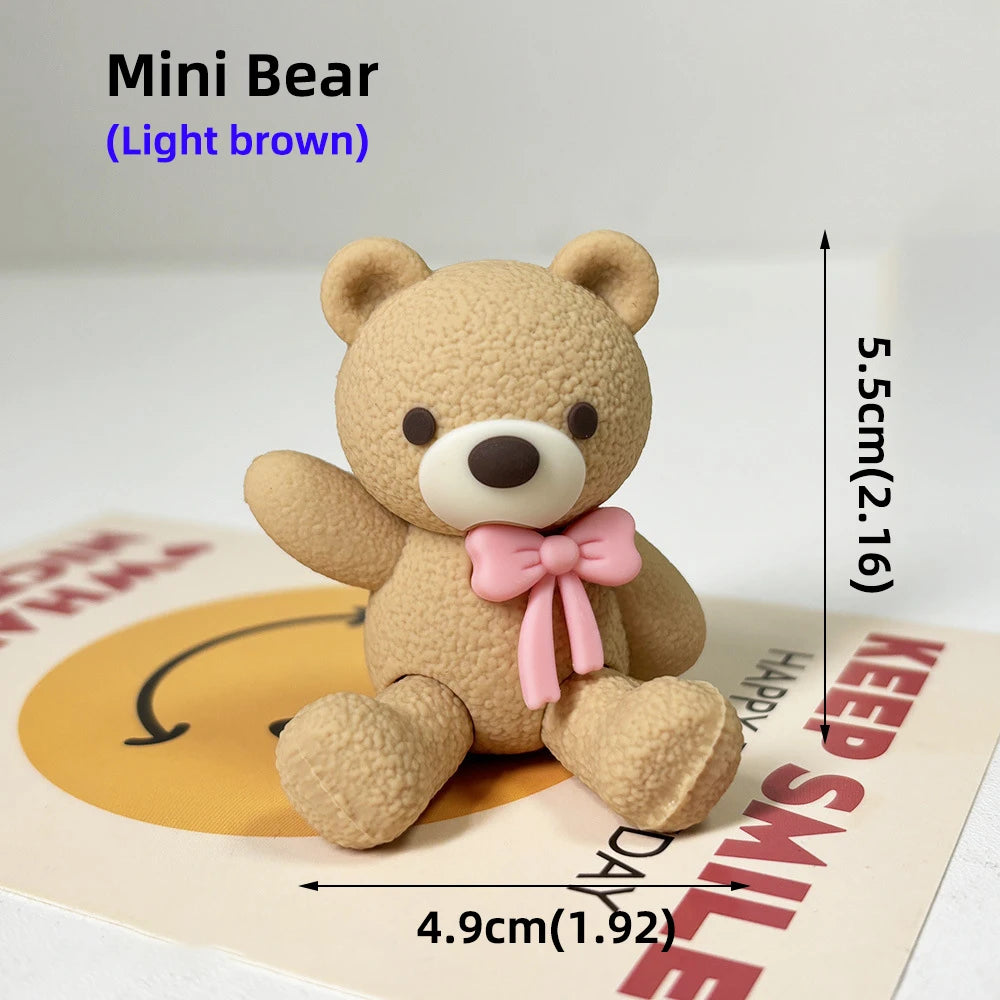 A light brown Mini Bear teddy bear toy shown against a card with text.
