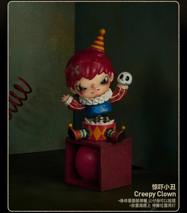 A collectible figure of a clown with red hair and a striped hat, featuring a skull accessory.