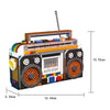 A retro radio building block set featuring an orange and black design with a vertical antenna.