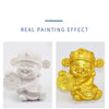 A pair of sculpted figures, one white and one gold, demonstrating a real painting effect.