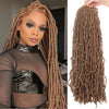 A close-up of long brown faux locs crochet hair with a distressed and butterfly style.