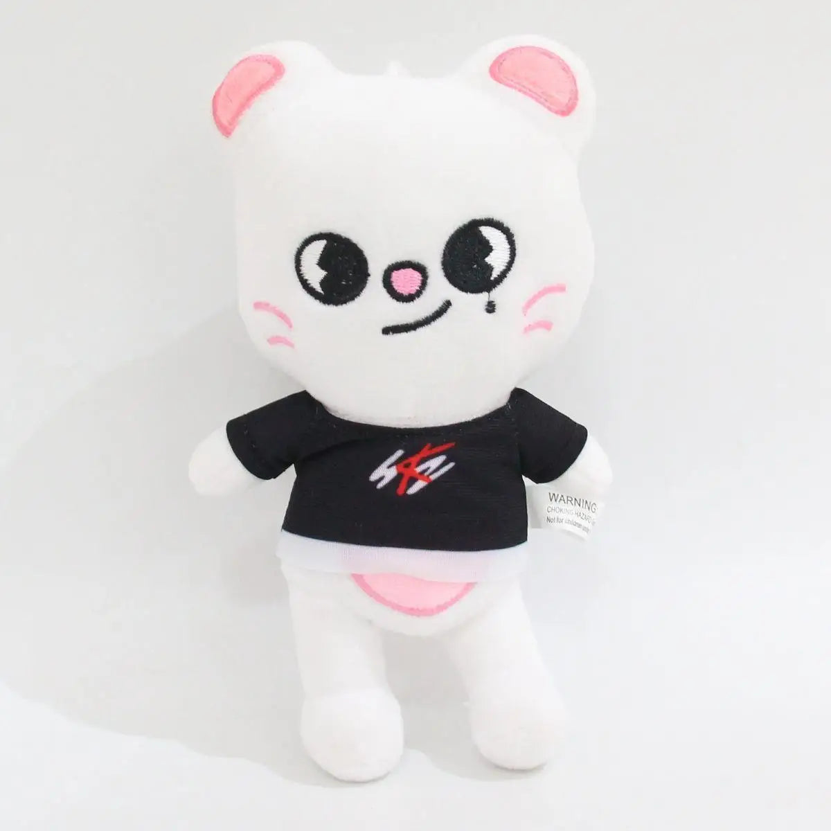 A white and pink cartoon cat plush toy with black accents.