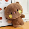 A brown panda plush toy with a stitched face and a measuring line indicating its size.