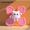 A single pink 4-petal bath toy shaped like a cute white animal is shown against an orange background.