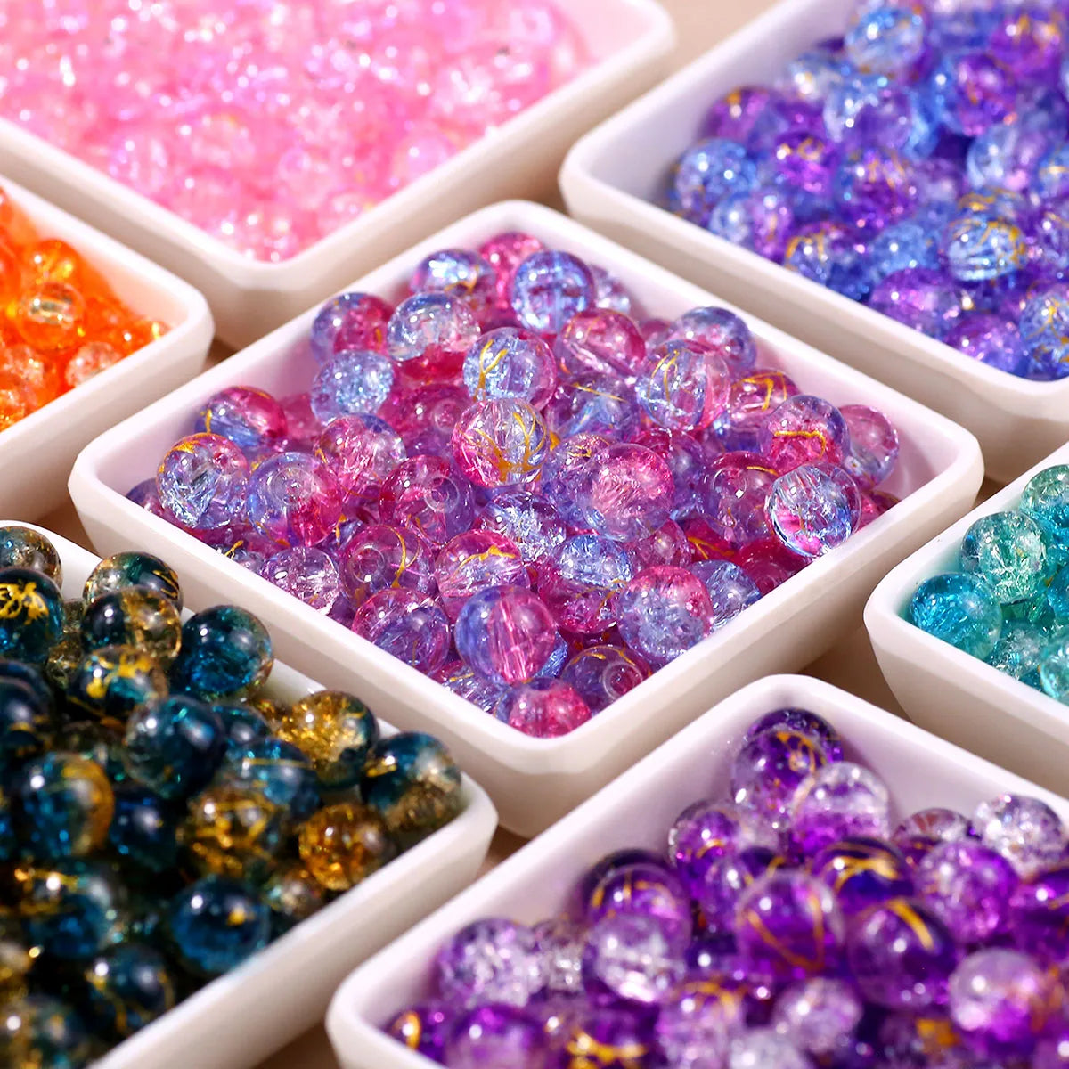 Assortment of gradient crystal glass beads with golden crackle finish in various colors and shades