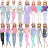 A collection of fashion doll outfits featuring various tops and pants in pastel and vibrant colors.