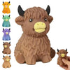 A collection of various colored cow squishy stress relief toys, including orange, green, purple, and brown.
