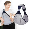 A woman is demonstrating an adjustable cotton ring sling baby carrier to a baby.