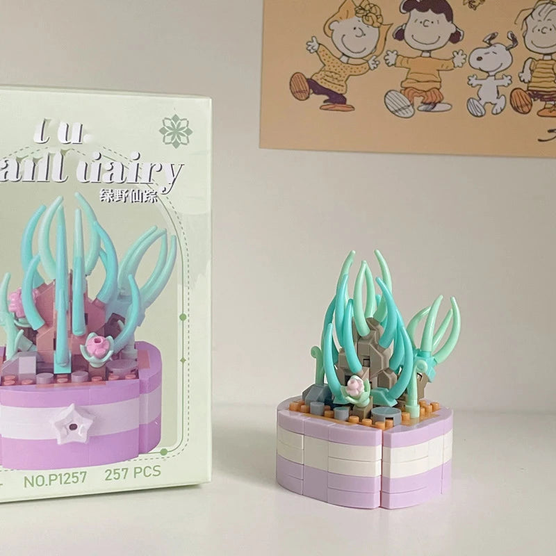 A pink and purple miniature flower bouquet building block set featuring teal colored flowers and leaves.