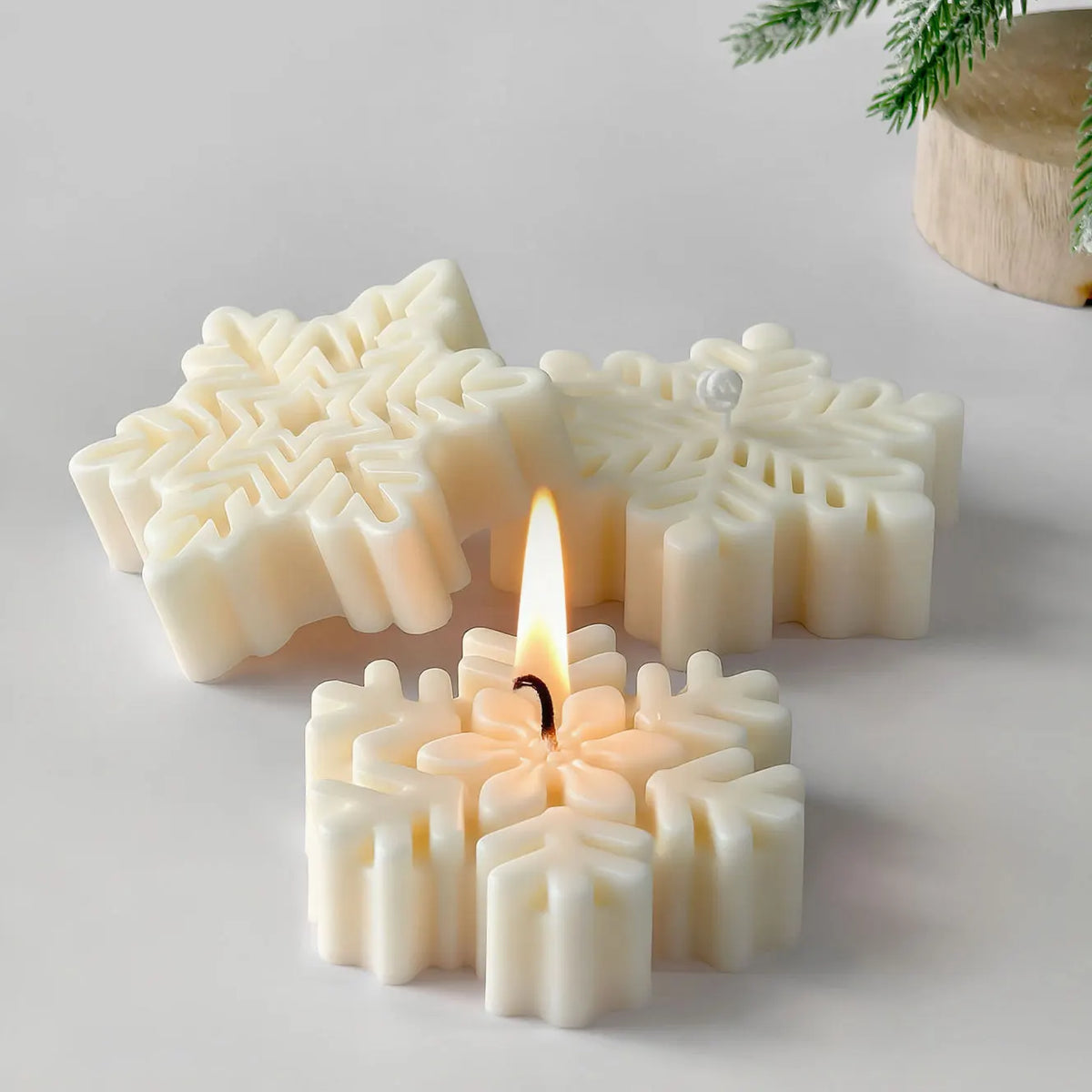 White snowflake silicone mold used for making candles, soap, and wax melts