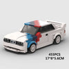 A white and blue classic rally car building block set with a detailed exterior.