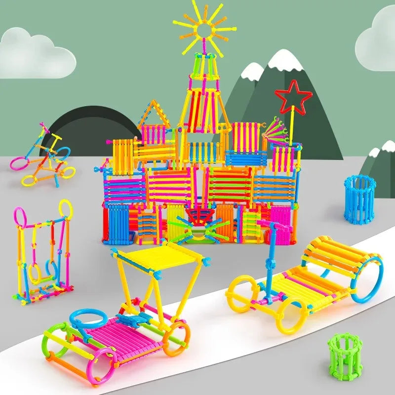 A colorful display of creative DIY stick building blocks and structures, including a large tower and various smaller componen