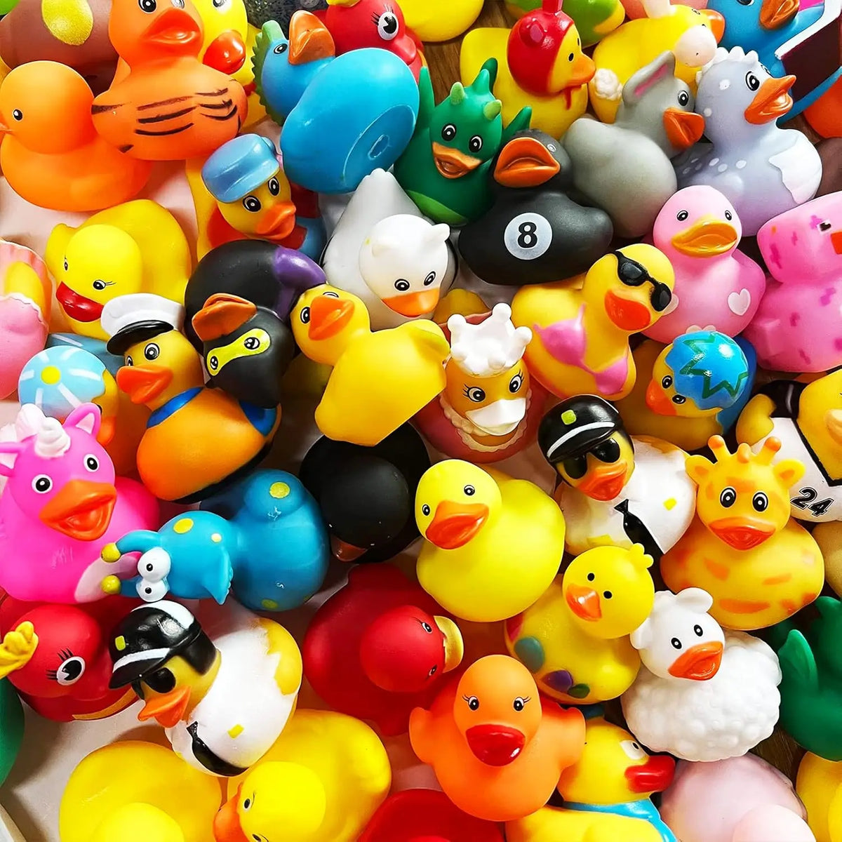 A collection of colorful rubber ducks in various shapes and colors for bath time fun
