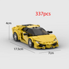 A yellow classic supercar model built from LEGO bricks, shown in a side view.