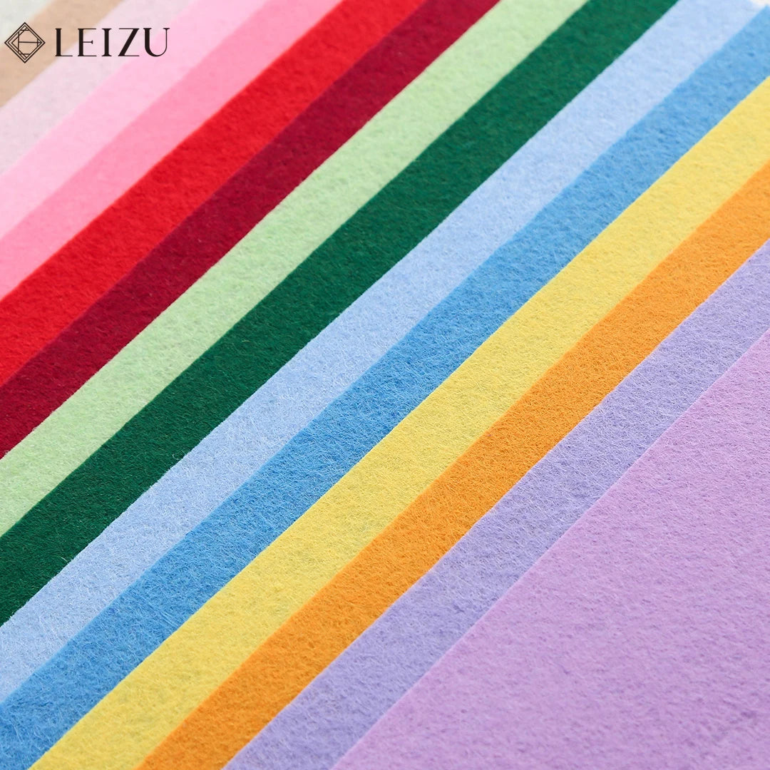 A close-up of colorful non-woven felt fabric sheets arranged in diagonal stripes.