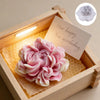 A pink floral silicone candle and resin mold is displayed inside a wooden box with a birthday message.