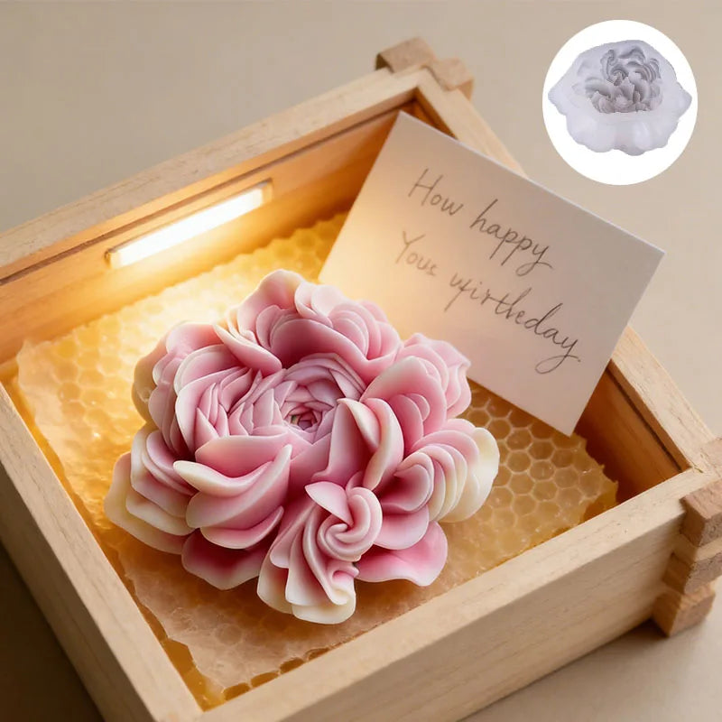 A pink floral silicone candle and resin mold is displayed inside a wooden box with a birthday message.