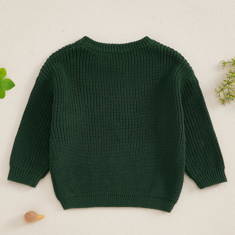 A dark green knit sweater for a baby or kid featuring letter embroidery.