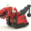 A red and black die-cast dinosaur truck toy with a removable dinosaur figure.