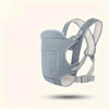 A light gray all-season multi-position baby carrier sling with a fabric pouch and adjustable straps.